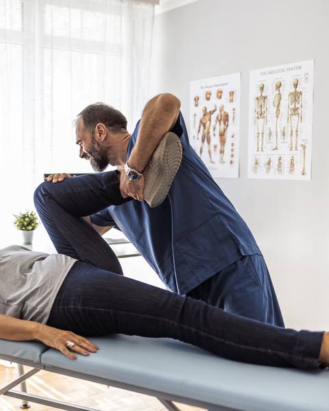Chiropractor treating a patient