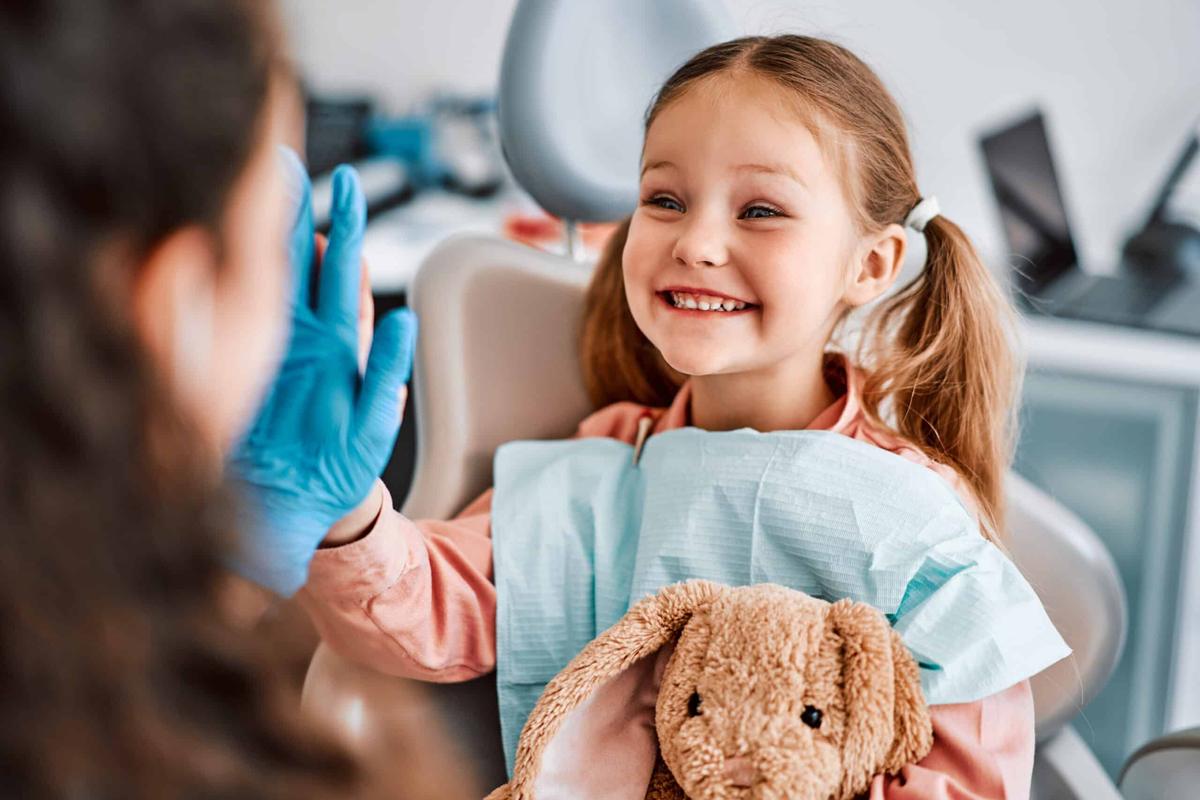 Smiling child at a pediatric dental visit